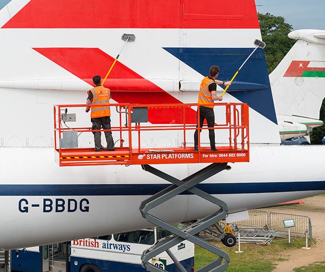 Star Platforms scissor lift powered access hire used to clean a plane.